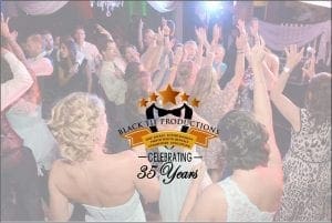 In the heart of a vibrant soirée, where excitement and elegance converge like never before, a dynamic crowd twirls across the dance floor. Above them, a radiant emblem shines in the sky: Black Tie Productions: Celebrating 35 Years. Powered by the unparalleled prowess of Event Heroes, we elevate your gatherings to legendary status. Whether you seek to orchestrate an unforgettable spectacle or infuse joy with our photo booth rental service, trust in Black Tie Productions—masters of celebration for over three decades—to transform any event into an epic affair!. :The Event Heroes at Black Tie Productions