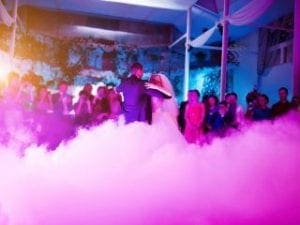 In a whirlwind of enchantment, the daring duo glides and twirls across the ethereal realm. The couple, radiant with heroic grace, commands the stage as vibrant beams of kaleidoscopic light cascade around them. Billowing clouds of mist swirl at their feet like mystical enhancers to their gravity-defying feat. All around, a captivated crowd watches in awe as these guardians of rhythm transform mere movement into a mesmerizing spectacle. :The Event Heroes at Black Tie Productions