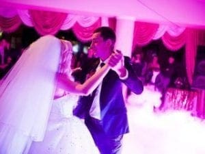 Under a luminous pink canopy, the bride and groom took to the dance floor like celestial beings gracing the Earth. Swirls of mystical smoke embraced them, transforming the wedding reception into an enchanting realm orchestrated by the legendary Black Tie Productions. The scene was electrified by none other than Michigans masterful DJ, whose powerful beats elevated this magical moment into an everlasting memory. :The Event Heroes at Black Tie Productions