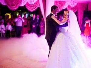 In a grand hall aglow with mesmerizing luminescence, the newlywed duo embraces their dance floor destiny. Veiled in an ethereal mist, they glide with grace and style amidst the spellbinding ambiance crafted by none other than Black Tie Productions. As they twirl under the watchful gaze of their awe-struck audience, their magical moment unfolds like a scene from a heroic saga—a testament to love’s enduring power. :The Event Heroes at Black Tie Productions