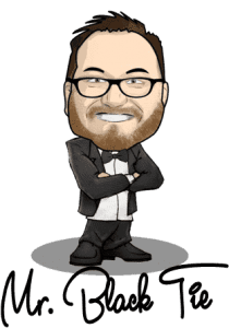 In a world where moments fly by faster than a speeding bullet, one hero stands ready to freeze time with the flash of his lens. Behold, Mr. Black Tie! Adorned in his snazzy tuxedo, glasses glinting like the city skyline at midnight, and a beard as sharp as his every move. Arms confidently crossed, he’s here to save your memories from fading into obscurity. Ready for any mission—be it gala or wedding—Black Tie Productions swoops in with elite photo booth rental services that capture your unforgettable moments with style and precision. Make no mistake; when Mr. Black Tie is at your event, your memories are in super hands! 🦸♂️📸✨. :The Event Heroes at Black Tie Productions