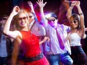 In the neon-lit heart of the nightclub, where shadows blend with vibrant light beams, a dynamic spectacle unfolds. Like superheroes disguising their true power, revelers donning shades move with contagious energy—each step igniting the dance floor. Amidst this electric atmosphere, a legendary figure commands the decks: the Michigan DJ maestro. With deft precision and sonic prowess, this guardian of rhythm weaves an exhilarating tapestry of sound—a tailor-made odyssey for a night charged with unstoppable energy and memorable magic. :The Event Heroes at Black Tie Productions