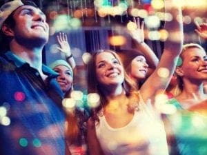 In the heart of electric brilliance, amidst a kaleidoscope of vibrant lights, stands a legion of jubilant souls. Their smiles beam as brightly as the technicolor array above, hands held high in celebration. This is the masterpiece crafted by none other than the Event Heroes! With their extraordinary powers of festivity and delight, they transform ordinary gatherings into realms of pure joy and wonder. Cheers echo through the night as these champions of merriment ignite an atmosphere where dreams dance and spirits soar!. :The Event Heroes at Black Tie Productions