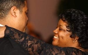 Amidst a swirl of elegance and grace, the dazzling Woman of Wonder beams at her partner, her arm effortlessly draped around his shoulder—a connection as powerful as any superhero bond. Clad in stunning attire that glimmers with every move, they dance amidst an ambiance transformed by the legendary Event Heroes, whose light artistry illuminates the night with a brilliance befitting such extraordinary beings. :The Event Heroes at Black Tie Productions