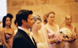 In an exquisite chamber bathed in ethereal light crafted by Black Tie Productions, the fearless Groom and his radiant Bride stand as guardians of love at the altar. Their steadfast presence is bolstered by their trusty trio of Bridesmaid heroes, each wielding vibrant bouquets like emblems of unity. Together, they embark on a legendary journey, cloaked in elegance and illuminated with heroism. :The Event Heroes at Black Tie Productions