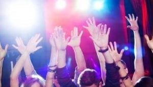 Amidst a symphony of vibrant beams and thundering beats, electrified concertgoers unleash their triumphant roars, hands raised high beneath the radiant glow of the stage lights. This spectacle is powered by none other than the indomitable Event Heroes, whose legendary energy surges through every Michigan wedding DJ gig, transforming mere celebrations into epic adventures of sound and spirit. :The Event Heroes at Black Tie Productions