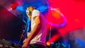 Under the radiant glow of vibrant lights, the Sonic Sentinel of Black Tie Productions stands at the mixing console—a superhero in crisp white attire, armed with headphones that serve as his ultimate weapon. His mission: to transform a Michigan wedding into a legendary celebration. With unparalleled expertise and electrifying event lighting, he crafts unforgettable moments, ensuring every heartbeat syncs with the rhythm of joy and unity!. :The Event Heroes at Black Tie Productions