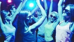 Under the radiant glow of multi-colored lights, a dynamic ensemble of shades-wearing individuals stepped onto the dance floor, ready to embrace the electrifying energy crafted by none other than the unstoppable Event Heroes. With every beat pulsating through the air, they moved with fearless exuberance, their synchronized steps turning an ordinary night into an extraordinary adventure. The atmosphere was alive with vivid colors and heroic beats that only our legendary Event Heroes could concoct, making every moment a testament to their incredible power to ignite joy and bring communities together in spectacular fashion!. :The Event Heroes at Black Tie Productions