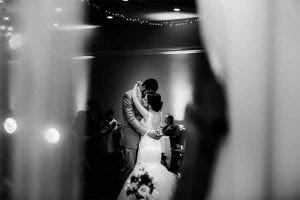 In the shadowy glow of their secret lair, the Bride and Groom unite for the first dance, igniting a symphony of romance that sweeps across their adoring allies. Around them, guests bask in radiant beams of elegance that illuminate this magnificent celebration. Commanding rhythm from his turntables, the Michigan Wedding DJ acts as maestro to this harmonious epic, setting an atmosphere of pure enchantment. Meanwhile, a whimsical photo booth serves as a portal to capture and preserve treasured memories forevermore. :The Event Heroes at Black Tie Productions