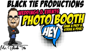 As the curtain rises, behold the gallant spectacle of a cartoon figure, adorned with glasses that shimmer with wisdom and flair, standing valiantly beside the illustrious Black Tie Productions insignia. This iconic emblem champions legendary weddings, unparalleled events, and whimsical photo booth adventures. With a mighty speech bubble bellowing forth Hey, this daring figure beckons you to unleash your creativity with an arsenal of dazzling props. Rise as an Event Hero by selecting their top-tier event lighting that paints the night in hues of wonder and entertainment solutions that electrify any gathering into legendary status! Embrace your destiny—let every moment dazzle with Black Tie magic!. :The Event Heroes at Black Tie Productions