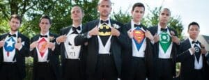 In a dazzling display of heroics, seven gallant groomsmen, clad in dapper tuxedos, revealed their true identities beneath their formal wear. As the music crescendoed, they tore open their shirts to unveil a magnificent array of iconic superhero emblems: Captain Americas star-spangled banner, Flashs lightning bolt of speed, Punishers emblem of justice served cold, Batmans dark knight insignia watching over the evening like a silent guardian, Superman’s S blazing hope anew, and Green Lanterns emerald beacon lighting the way. One among them showcased an exclusive crest—his unique super-symbol crafted for this very special occasion. Not far from this epic unveiling stood Event Heroes themselves—guardians of unforgettable memories—capturing every moment with unparalleled precision and offering their state-of-the-art photo booth rental service for guests eager to capture a slice of super-powered fun! Yes indeed; this reception was more than mere celebration—it was an epic chapter in heroic camaraderie!. :The Event Heroes at Black Tie Productions