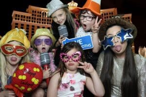 In a vibrant cityscape bustling with life, young heroes don their playful armors and whimsical disguises, standing ready to unleash joy. With capes fluttering and masks in place, these pint-sized protectors strike dynamic poses that rival any adventure story. Their mission? To capture the iconic essence of wonder and laughter that defines every epic photo booth experience. Theyre not just pretending; theyre channeling the spirit of true champions!. :The Event Heroes at Black Tie Productions