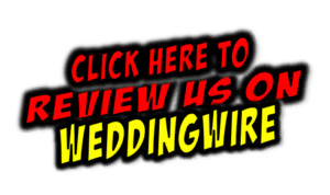 In a dynamic display of bold red and yellow letters set against a sleek black backdrop, the call to action reads: Click here to review us on WeddingWire! Unleash the power of Event Heroes as they soar to new heights, transforming your occasion into an extraordinary experience. Dive into our premium photo booth rental and craft unforgettable memories that will stand the test of time!. :The Event Heroes at Black Tie Productions