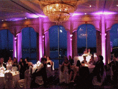 In the epicenter of joy and union, guests gathered in a grand chamber adorned with ethereal pink uplighting and dazzling chandeliers. The dimly lit room was transformed into a realm of elegance and wonder by the impeccable craft of Black Tie Productions. Their powers wielded a radiant aura that cast an enchanting spell, ensuring this wedding reception was nothing short of legendary. :The Event Heroes at Black Tie Productions