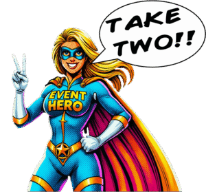 Event Hero, clad in bold blue and yellow, raises two heroic fingers and declares, "TAKE TWO!!" with dynamic comic flair. :The Event Heroes at Black Tie Productions